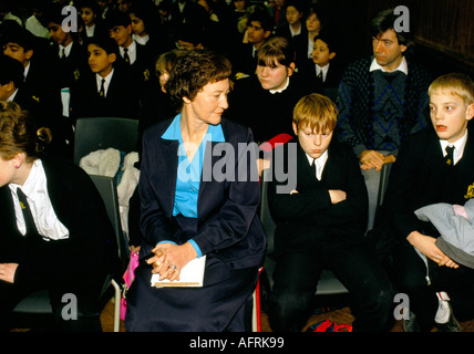 Headteacher Secondary School 1990s UK. Morning assembly with children, Mrs Oliver the Head, sitting amongst pupils. Greenford High School, Middlesex Stock Photo