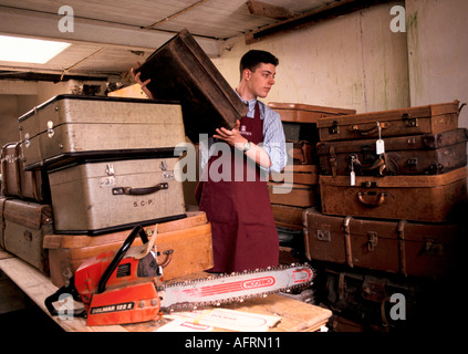 Auction at a country house sale Newnham Hall Northamptonshire 1994, Christies porter moving stuff thats for sale making more accessible 1990s UK Stock Photo