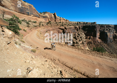 Model released mountain bikers on Shafer Trail Canyonlands National Park Utah USA Stock Photo