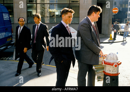 Lloyds of London Insurance brokers in their lunch hour. Young business men in formal office work suits 1992 City of London 1990s UK HOMER SYKES Stock Photo