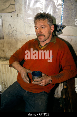 Workman drinking a mug of tea. South Wales UK HOMER SYKES Stock Photo