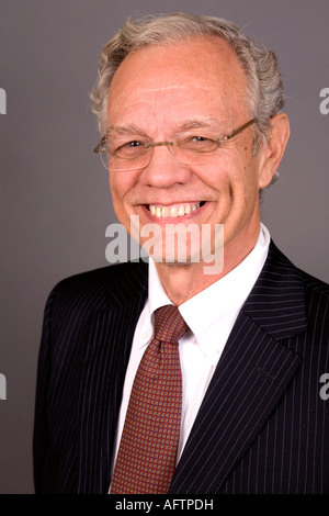 Portrait of smiling senior businessman. Happy old man in black suit and ...