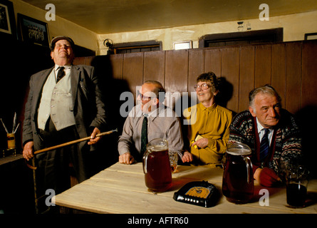 Story telling, reciting poetry farmers countrymen gather at Kings Head the Low House pub on Sunday mornings 1980s 1985 Laxfield Suffolk UK Stock Photo