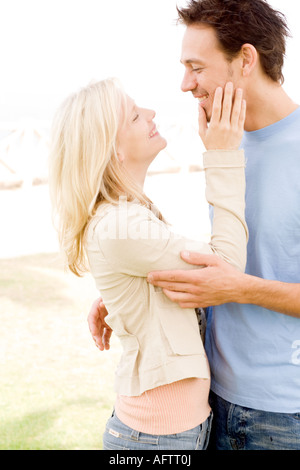 Mature couple embracing each other, smiling Stock Photo