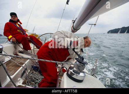 Yachting UK. Crew in The Round the Island Race, the isle of Wight England 1980s HOMER SYKES Stock Photo