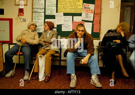 Doctors waiting room, GP surgery patients unwell, ill wait to be able to see their NHS doctor. East End London 1989 1980s UK HOMER SYKES Stock Photo