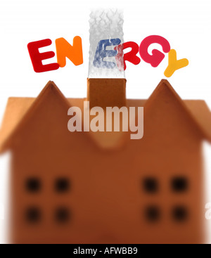 Conceptual image showing energy in the home with smoking chimney Stock Photo