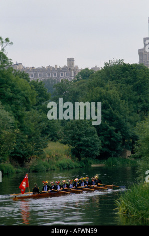 School boys Eton College school 'Windsor Castle' in background. 'Founders Day'  Fourth 4th June Procession of Boats  Windsor Berkshire. 1980s 1985 Stock Photo