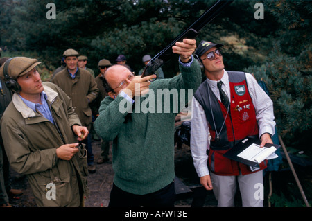 Michael Spencer chief executive of ICAP Clay Pigeon Charity shoot Bisley shooting ground. Office away day. Surrey England. 2000s Circa 2005 Stock Photo