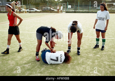 Argentina women playing football 2002, The Exactas soccer all womens five a side team practice team player hurt. Buenos Aires 2000s HOMER SYKES Stock Photo