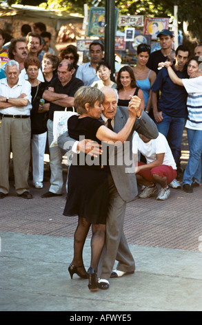 Tango Argentina Elderly couple dancing the tango in Plaza Dorrego, San Telmo district. Buenos Aires Argentina. 2000s 2002 HOMER SYKES Stock Photo