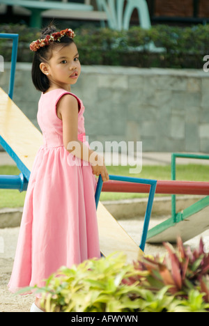 philippines young filipina girl dressed in pink gown for wedding ceremony afwywn