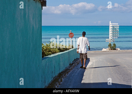 Street leading to the shore in Tarpum Bay on the island of Eleuthera Bahamas Stock Photo