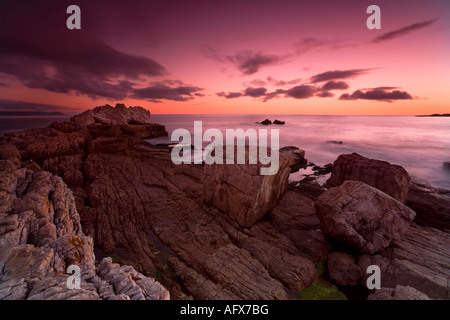 Stunning sunset on the rocky outcrop in Hermanus South Africa Stock Photo