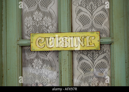 cuisine sign on old cafe door, france Stock Photo