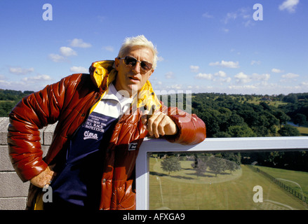 Jimmy Savile British entertainer disc jockey TV radio broadcaster seen his flat balcony overlooking Roundhay Park. Leeds  Late 1980s or early 1990s. Stock Photo
