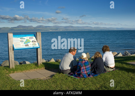 Family picnic on the seafront  Criccieth Cricieth town Lleyn peninsula Gwynedd north wales - summer holiday by the sea Stock Photo
