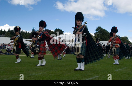 Pipe band marching at a Scottish Highland Games Stock Photo