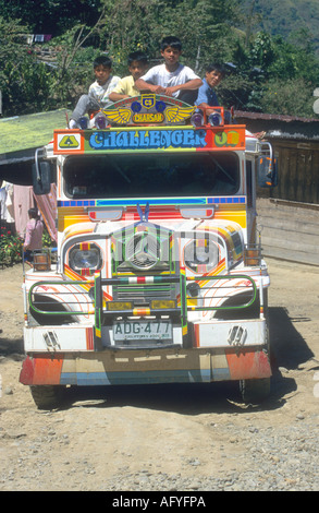 a traditional painted Jeepney,public transport, at the famous Banaue 2000 year old rice terraces in Luzon,Philippines Stock Photo