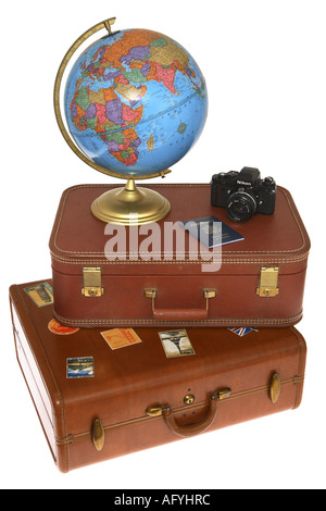 Globe, Camera and Passport on Stack of Suitcases Stock Photo
