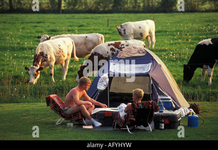 Netherlands Emmen Friends camping on farm Stock Photo
