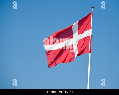 Danish Flag Blue Sky A Danish flag flying in a breeze in the sunshine and against a blue sky Funen Fyn Denmark