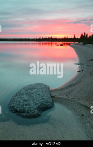 Colorful sunset at Indian lake (near Whitefish lake), in an area called The Barrenlands, Northwest Territories, Canada. Stock Photo