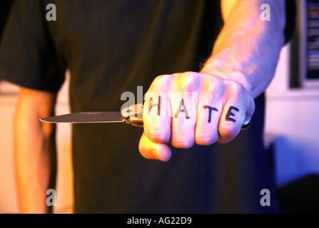 Hand holding a knife Stock Photo