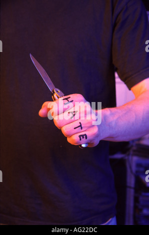 Hand holding a knife Stock Photo