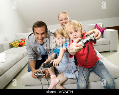 Family playing compouter game Stock Photo