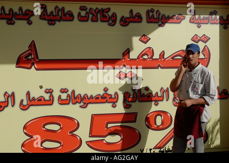 A restaurant worker using a cellular phone, Amman Jordan Stock Photo