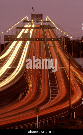 Harbour Bridge over the Waitemata Harbour Auckland City at rush hour and dusk Stock Photo