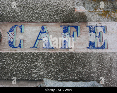 weather beated inscription of a coffee house Stock Photo