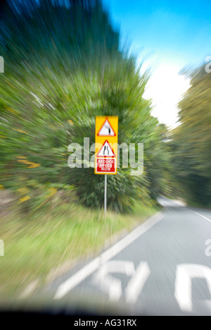 warning sign on the approach to a bend. Stock Photo