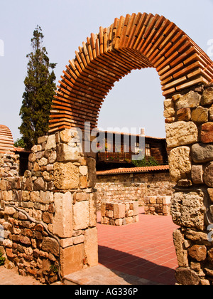 Traditional arch gate and stone wall in Sozopol Bulgaria Stock Photo