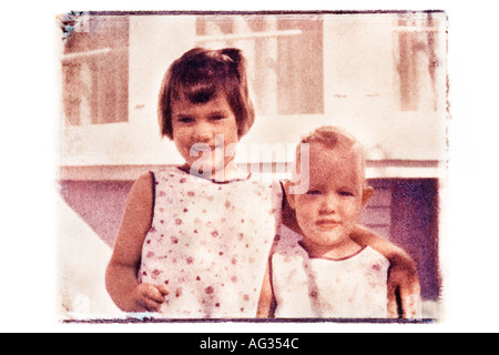 Polaroid transfer image of two girls in matching clothes circa 1960s Stock Photo