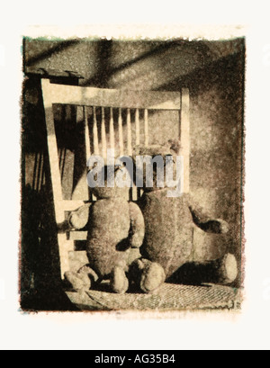 Black and white polaroid transfer image of two teddy bears in wicker chair Stock Photo