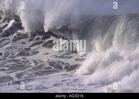 A classic powerful foaming white and grey big wave breaking and crashing over at Saunton Point Croyde Bay Devon England Stock Photo