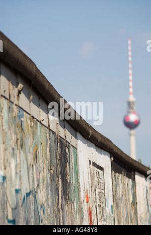 Berlin Wall at East Side Gallery and Television Tower in distance in Berlin Germany Stock Photo