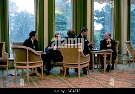 Business men enjoy a coffee break during a business conference at a hotel in Eastbourne, UK. Stock Photo