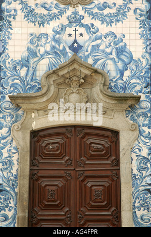 Painted tin-glazed ceramic tilework decorating a doorway of the 18th century Igreja do Carmo Church in Porto Northern Portugal Stock Photo