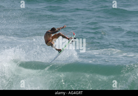 Professional surfer Christian Fletcher flying through the air in Huntington Beach California Stock Photo