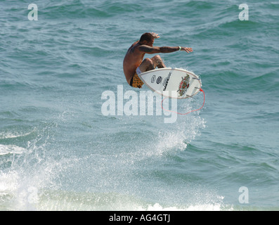 Professional surfer Christian Fletcher flying through the air in Huntington Beach California Stock Photo