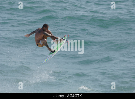 Professional surfer Christian Fletcher flying through the air in Huntington Beach California Stock Photo