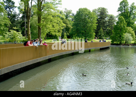 View of Sackler Crossing bridge over the lake Royal Botanic Gardens Kew Richmond Surrey England Britain UK Europe EU Stock Photo