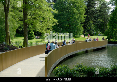 View of Sackler Crossing bridge over the lake Royal Botanic Gardens Kew Richmond Surrey England Britain UK Europe EU Stock Photo