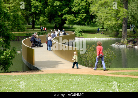 View of Sackler Crossing bridge over the lake Royal Botanic Gardens Kew Richmond Surrey England Britain UK Europe EU Stock Photo