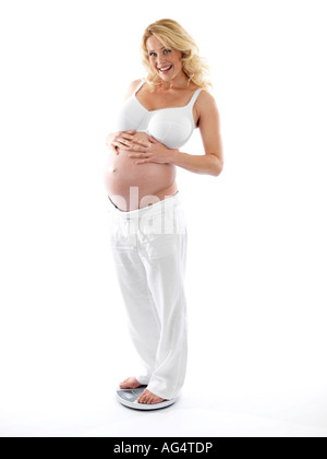 Pregnant Woman Using Weighing Scales Model Released Stock Photo