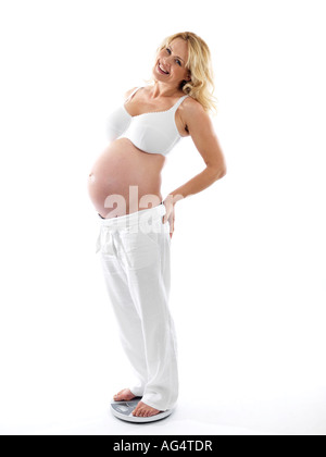 Pregnant Woman Using Weighing Scales Model Released Stock Photo