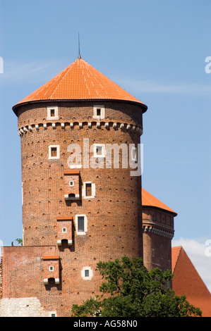 Senatorska Tower and defence walls of Wawel Royal Castle against a clear blue sky in Cracow, Poland. Historic brick architecture and fortification. Stock Photo